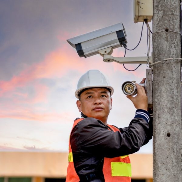 stock-photo-a-cctv-installer-is-installing-a-security-camera-camera-and-security-concept-1984531442-transformed