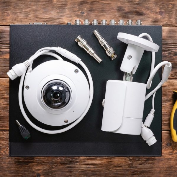 stock-photo-modern-white-security-cameras-and-video-recorder-on-the-table-video-surveillance-concept-1774144829-transformed